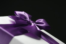 White Gift Box With Purple Ribbon And Bow