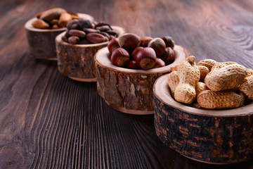 Wall Mural - Assortment of tasty nuts on wooden background