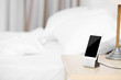 Smart phone on nightstand in bedroom