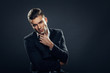 © djile - Portrait of handsome man in a studio on a dark background