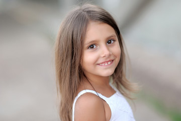 portrait of little girl outdoors in summer