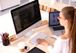 © shefkate - Young woman working in office, sitting at desk