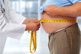 Fototapeta Konie - Doctor measuring obese man stomach.