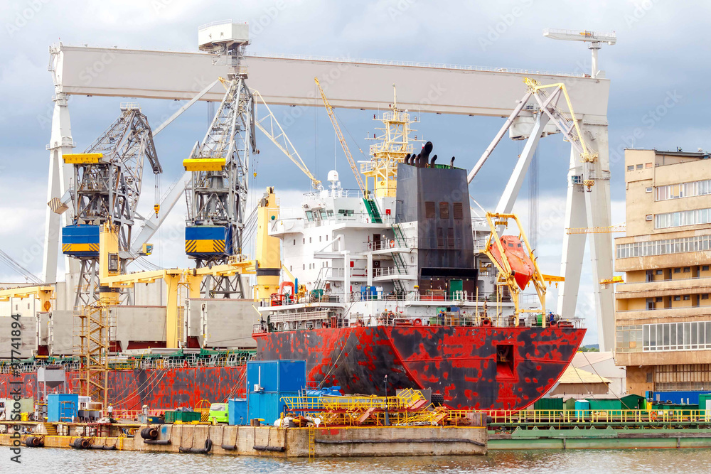 Gdynia. Cargo ship at the dock. - obrazy, fototapety, plakaty 