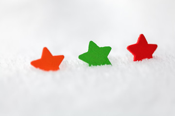 Wall Mural - christmas background with copy space. Three stars on snow