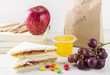 © matucha12 - Lunchbox in school: sandwich with peanut butter and jam, apple, jelly