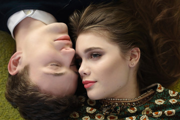 young couple closeup portrait facing each other