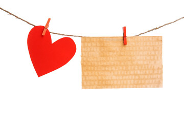 Wall Mural - Paper heart and empty sheet hang on cord isolated on white background