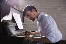 Handsome Man Plays Piano In The Class