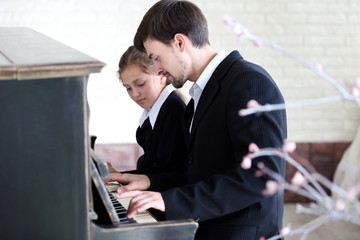 Poster - Musician teacher trains to play piano little girl