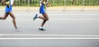 © lzf - Marathon runners running on city road