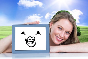 Canvas Print - Composite image of woman showing tablet pc 