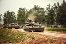 Russian Tanks Driving On A Country Road