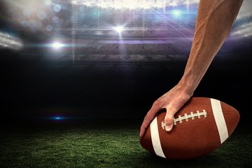 Poster - Composite image of american football player placing the ball