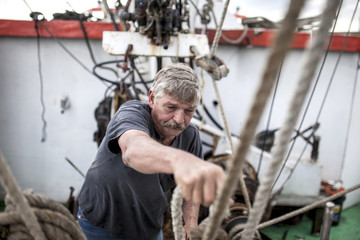 Wall Mural - Deckhand doing hard work