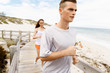 © Sergey Nivens - Runners. Young couple running on beach