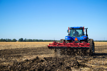 Tractor work the land on a farm