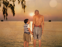  Grandfather And Grandson Standing At The Beach Sunset Backgroun