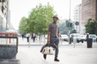 © Eugenio Marongiu - Young handsome afro black man walking in the street of the city,