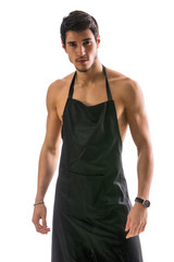 Wall Mural - Young sexy shirtless chef or waiter wearing only apron