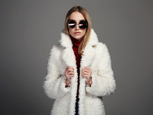 Beautiful Winter Girl In White Fur And Sunglasses. Winter Fashion 