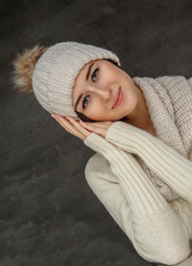 Wall Mural -  Smiling woman in white pulover.