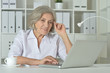 © aletia2011 - Elderly woman working on laptop