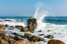 Powerful Waves On A Rocky Beach