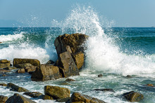 Powerful Waves On A Rocky Beach