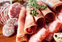 Cold Cuts: Charcuterie Assortment On Wooden Board