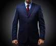 © opolja - man in suit on black background