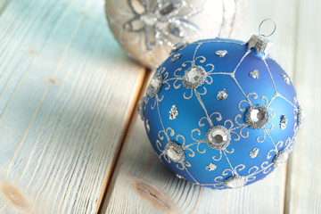 Sticker - Christmas baubles on wooden background