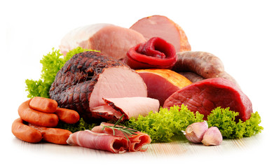 Wall Mural - Meat products including ham and sausages isolated on white