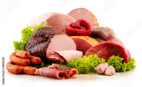 Fototapeta na wymiar Meat products including ham and sausages isolated on white