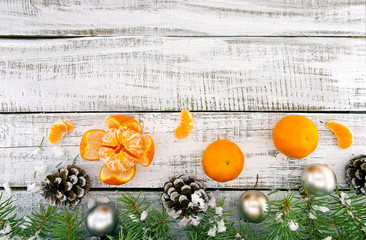 Wall Mural - Composition with decorated Christmas tree, pinecone and mandarin