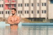 © Jale Ibrak - Man Resting Relaxed On Edge Of Swimming Pool