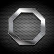 Metal octagon logo on perforated background