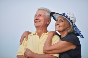 Wall Mural - elderly couple  on the background of sky