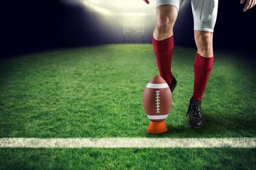 Poster - Composite image of low section of sports player kicking ball