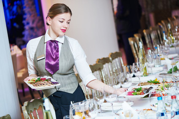 Canvas Print - Waitress serving banquet table