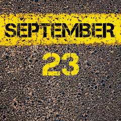 Wall Mural - 23 September calendar day over road marking yellow paint line