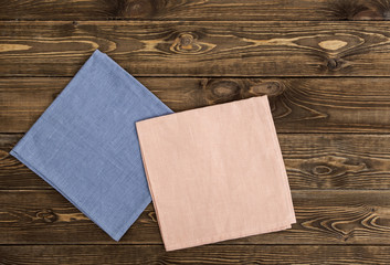 Wall Mural - colored napkin on a wooden table. top view