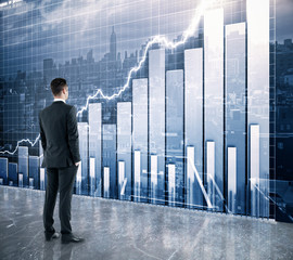 Wall Mural - Businessman looking at the scoreboard with business chart and ci