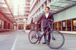 © Sergey Nivens - Successful businessman with bicycle