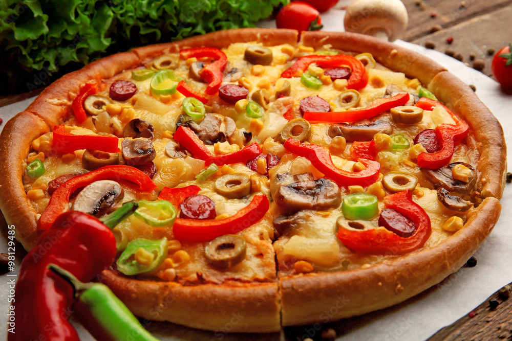 Delicious sliced pizza with vegetables, close-up