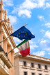 Italian and European Union flags waving from the embassy balcony in London exterior view outdoors front entrance