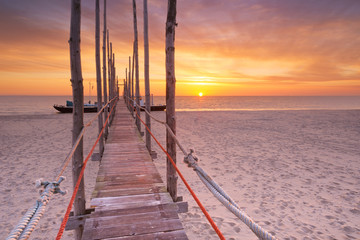 Wall Mural - Seaside jetty at sunrise on Texel island, The Netherlands