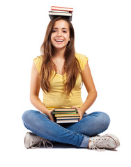 Wall Mural - young woman holding books on her head isolated on white