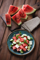 Wall Mural - Salad with ripe watermelon, fresh cucumber and sheep milk cheese