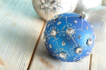 Sticker - Christmas baubles on wooden background